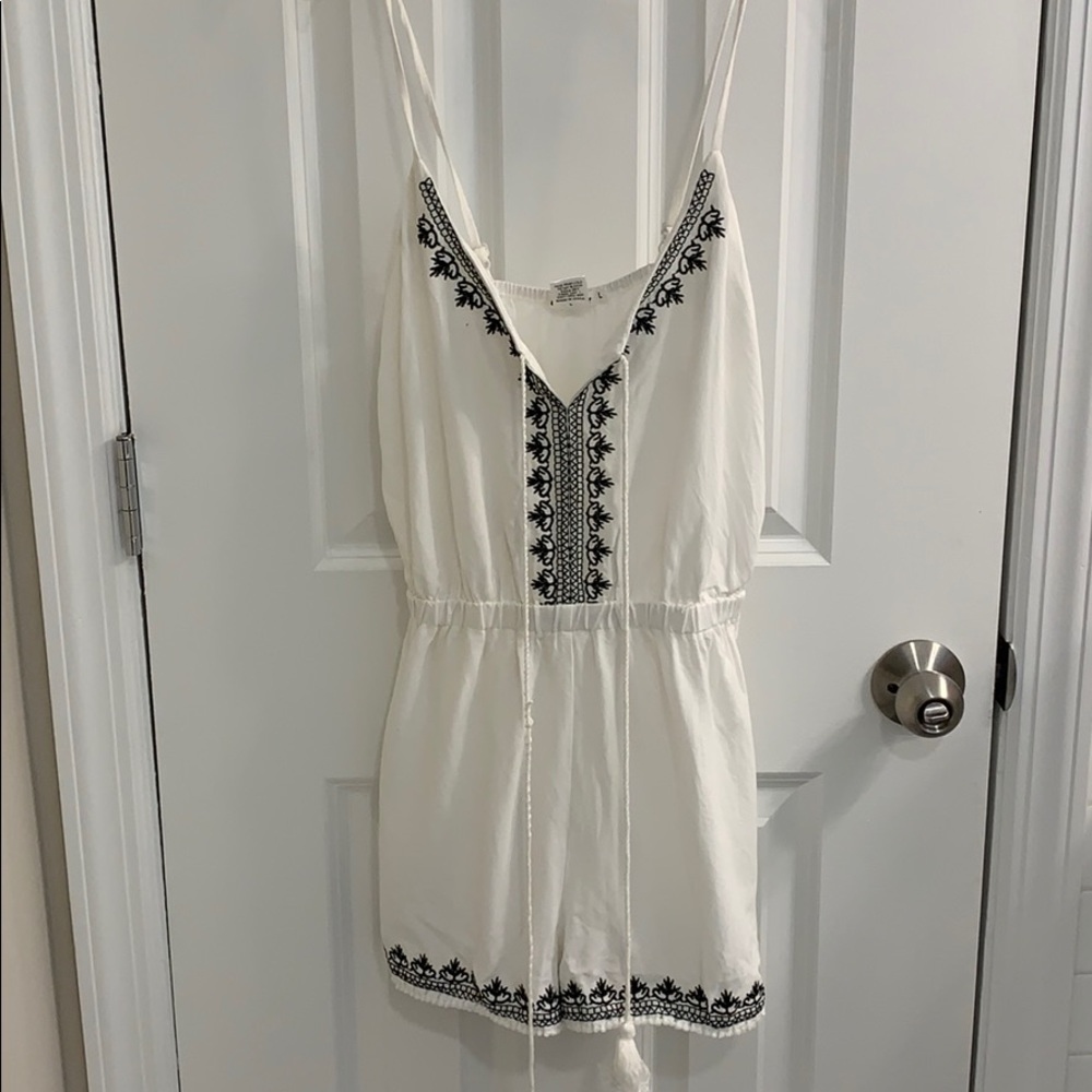 White romper with black embroidery
